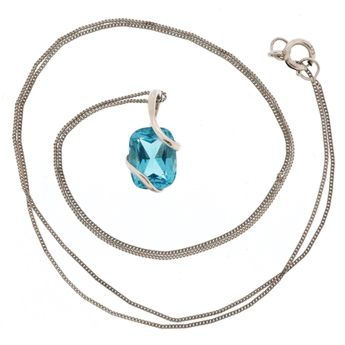 135 - A 9ct white gold blue topaz pendant on a 9ct white gold necklace, the topaz approximately 7.90mm x 6... 