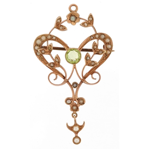 An Art Nouveau 9ct gold seed pearl and peridot openwork pendant brooch, 4.5cm high, 3.9g.