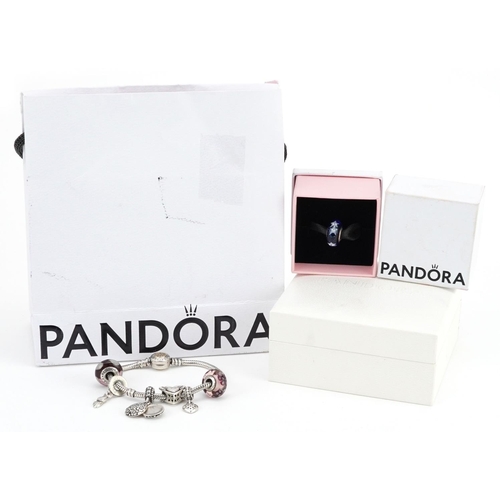 378 - A Pandora silver charm bracelet with seven charms, 17cm in length, 33.0g, with boxes and gift bag.