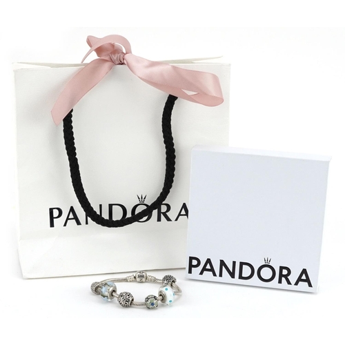 396 - A Pandora silver charm bracelet with six charms, 17cm in length, 34.4g, with box and gift bag.