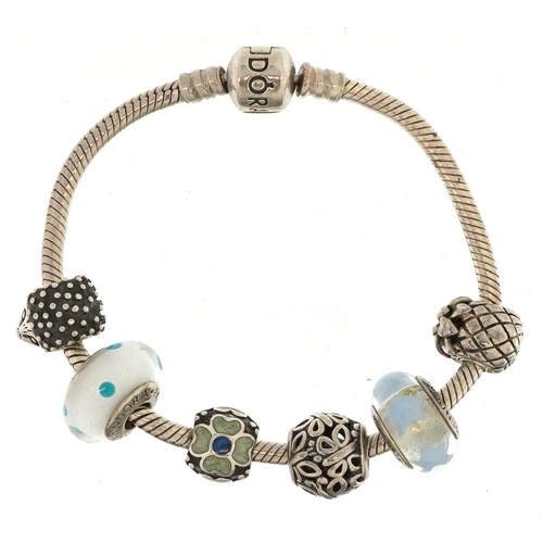 396 - A Pandora silver charm bracelet with six charms, 17cm in length, 34.4g, with box and gift bag.