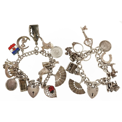 384 - Two silver charm bracelets with a collection of mostly silver charms including a matador, Nefertiti ... 