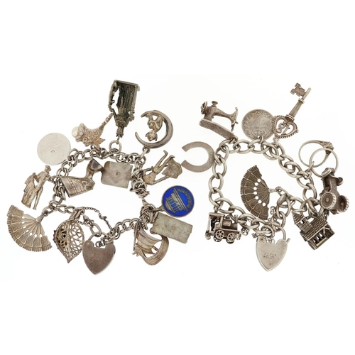 384 - Two silver charm bracelets with a collection of mostly silver charms including a matador, Nefertiti ... 