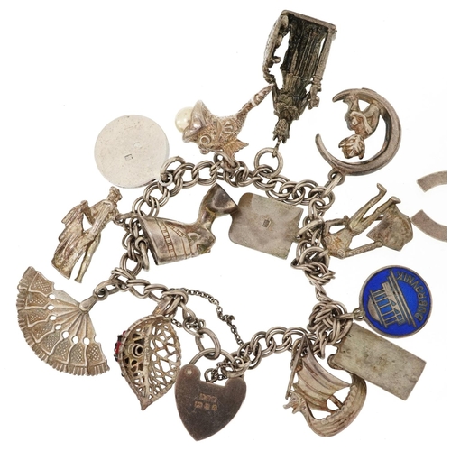 384 - Two silver charm bracelets with a collection of mostly silver charms including a matador, Nefertiti ... 