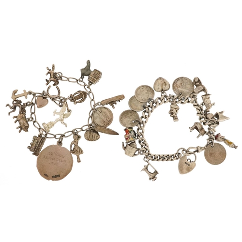 328 - Two silver and white metal charm bracelets with a collection of mostly silver charms including coins... 