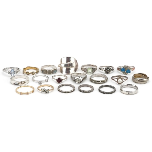 610 - Twenty silver and white metal rings, some set with semi precious stones, various sizes, total weight... 