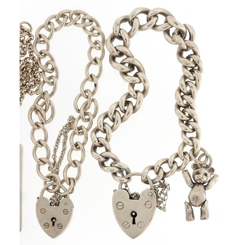 606 - Two silver bracelets with love heart padlock clasps, two silver ingot pendants and a silver Belcher ... 