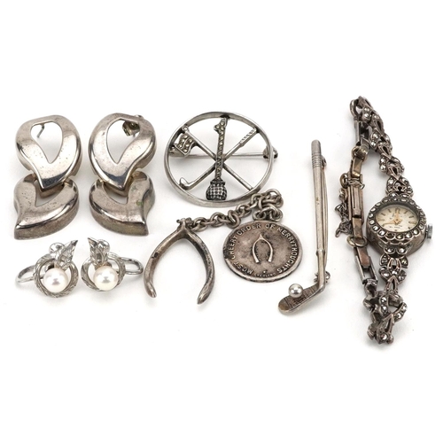 588 - Antique and later silver jewellery including a ladies marcasite wristwatch, two golfing interest bro... 