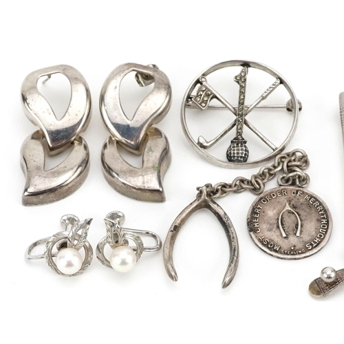 588 - Antique and later silver jewellery including a ladies marcasite wristwatch, two golfing interest bro... 