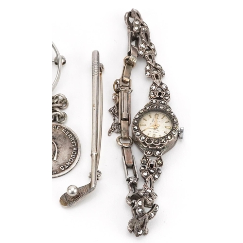 588 - Antique and later silver jewellery including a ladies marcasite wristwatch, two golfing interest bro... 