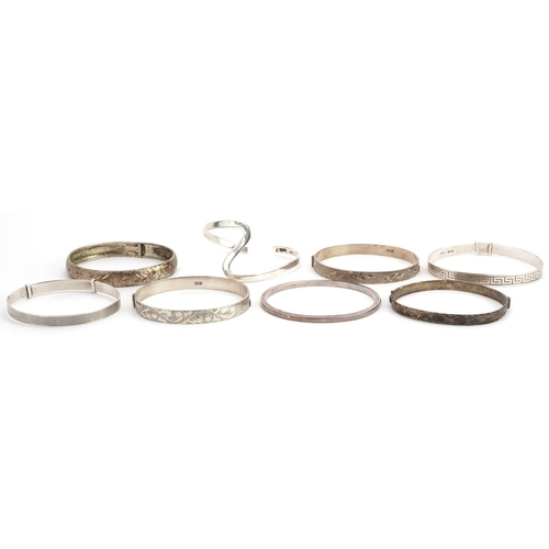 621 - Eight vintage and later silver bangles and bracelets including christening bracelets, total 98.8g.