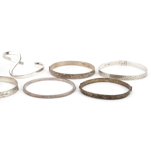 621 - Eight vintage and later silver bangles and bracelets including christening bracelets, total 98.8g.