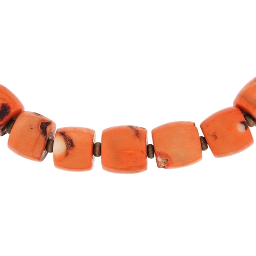 611 - A large natural coral segment necklace, 50cm in length, 197.5g.