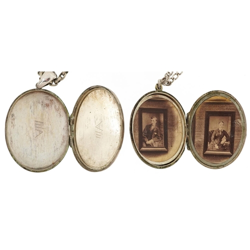 607 - Two Victorian white metal oval lockets with engraved decoration, one with silver necklace and one wi... 