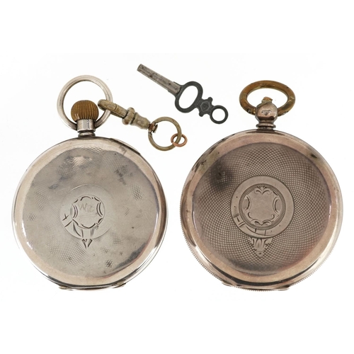 612 - Two gentlemen's silver open pocket watches, each having enamelled and subsidiary dials with Roman an... 