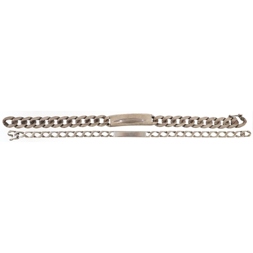 421 - Two silver unengraved identity bracelets, each 22cm in length, total 63.0g.