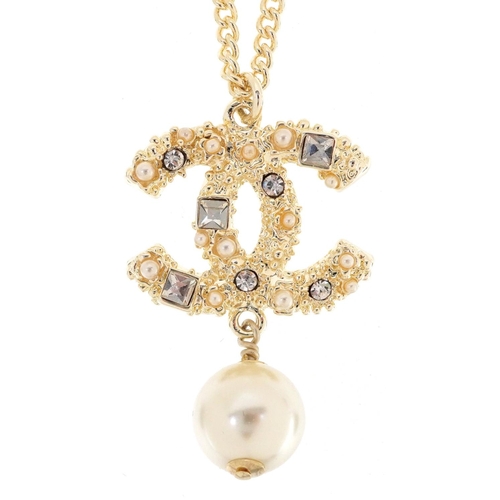  Chanel, vintage ladies Chanel monogram pendant set with clear stones and a simulated pearl, 4cm high... 