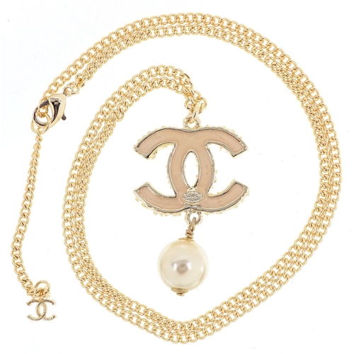  Chanel, vintage ladies Chanel monogram pendant set with clear stones and a simulated pearl, 4cm high... 