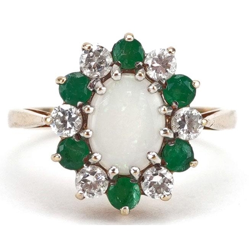 295 - A 9ct gold cluster ring set with a cabochon opal, emeralds and clear stones, size J, 2.5g.