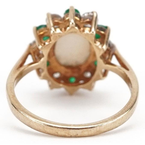 295 - A 9ct gold cluster ring set with a cabochon opal, emeralds and clear stones, size J, 2.5g.