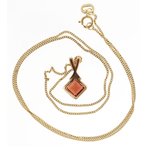 131 - A 9ct gold garnet pendant on a 9ct gold necklace, 1.5cm high and 40cm in length, total 1.8g.