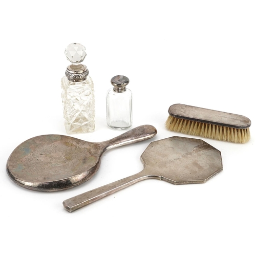 702 - Victorian and later silver mounted vanity items including an engine turned hand mirror and two cut g... 