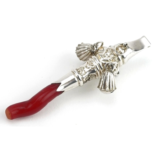 685 - A Victorian style unmarked silver baby's rattle/whistle with coral T bar, 7.5cm in length, 12.0g.