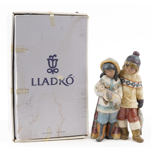 721 - A Lladro Gres figure group of an Eskimo boy and girl with seal pup and fish, numbered 2227, 30cm hig... 