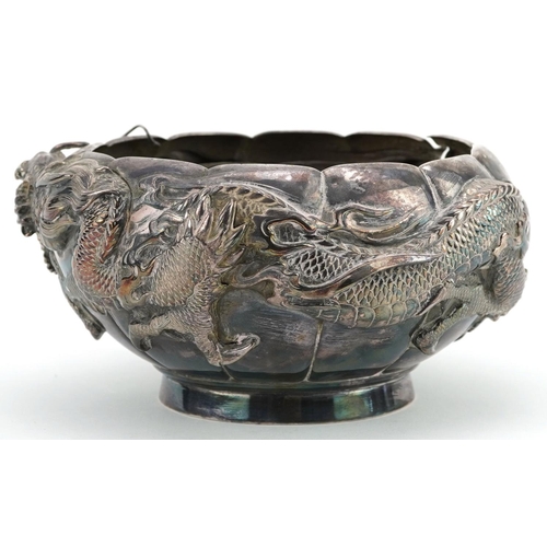 A Chinese export silver bowl embossed with a continuous dragon, with pewter liner, impressed marks to the base, 16cm in diameter, total weight 530.0g.