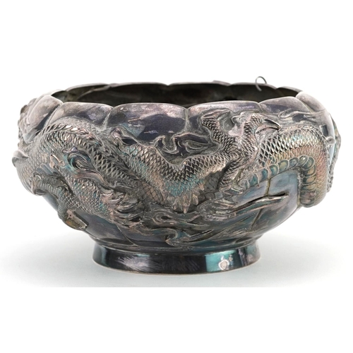  A Chinese export silver bowl embossed with a continuous dragon, with pewter liner, impressed marks t... 