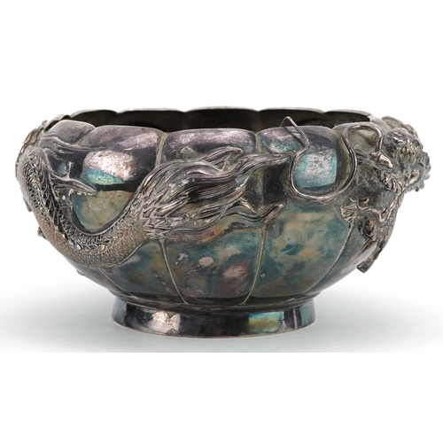  A Chinese export silver bowl embossed with a continuous dragon, with pewter liner, impressed marks t... 