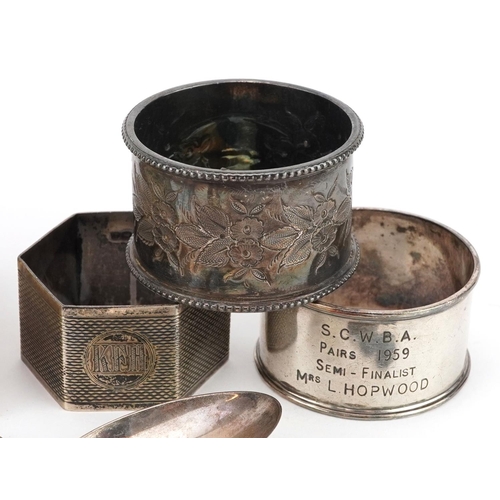 679 - Edwardian and later silver items comprising three napkin rings and four bowling club teaspoons, tota... 