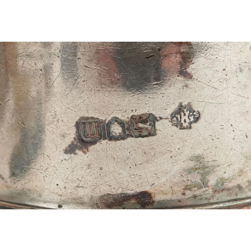 679 - Edwardian and later silver items comprising three napkin rings and four bowling club teaspoons, tota... 