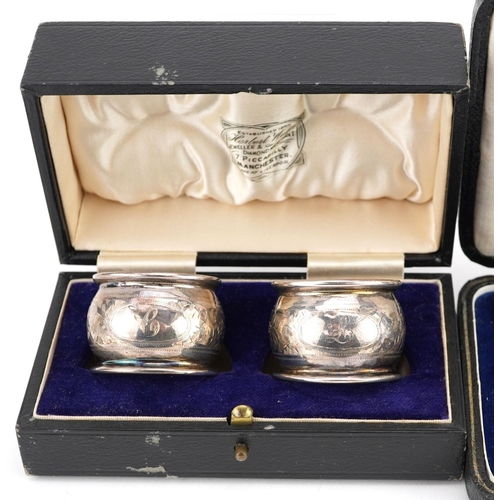 697 - Edwardian and later silver items comprising three napkin rings and a set of six coffee bean spoons, ... 