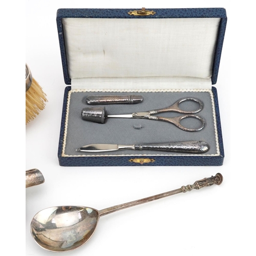 703 - Antique and later silver items including an apostle spoon, ashtray, silver backed clothes brush and ... 