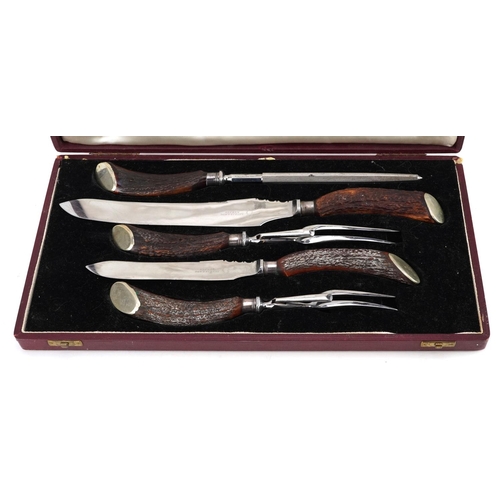 714 - Asprey & Co, a five piece carving set with horn handles housed in a velvet and silk lined fitted cas... 