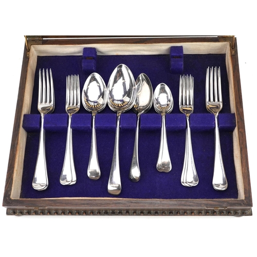 711 - An oak six place canteen of Dixon stainless steel cutlery