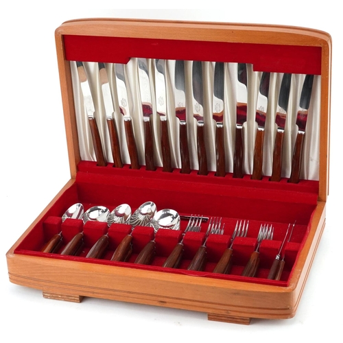 707 - A vintage Sanenwood canteen of stainless steel cutlery with wooden handles, the canteen 45.5cm wide.