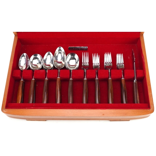 707 - A vintage Sanenwood canteen of stainless steel cutlery with wooden handles, the canteen 45.5cm wide.