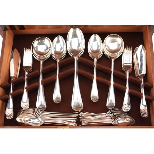  An Art Deco canteen of silver plated and stainless steel cutlery, the knives with ivorine handles, t... 