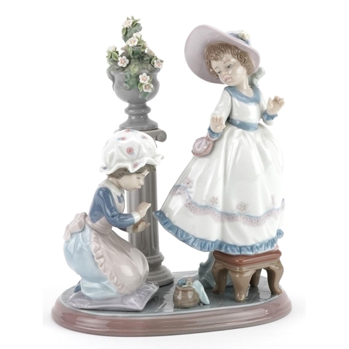 734 - A Lladro figure group of two young girls - A Stitch in Time, numbered 5344, 24cm high, with box.