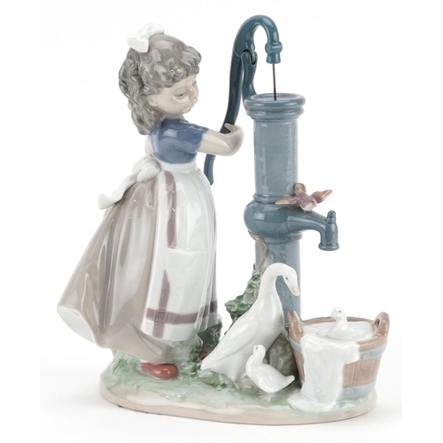 733 - A Lladro figure of a young girl pumping water - Summer on the Farm, 24cm high, with box, the box num... 