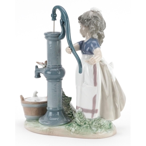 733 - A Lladro figure of a young girl pumping water - Summer on the Farm, 24cm high, with box, the box num... 