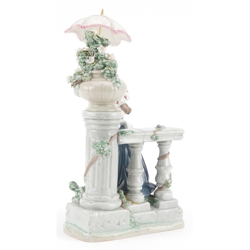 732 - A Lladro figure of a young girl holding an umbrella - Glorious Spring, 31cm high, with box, the box ... 