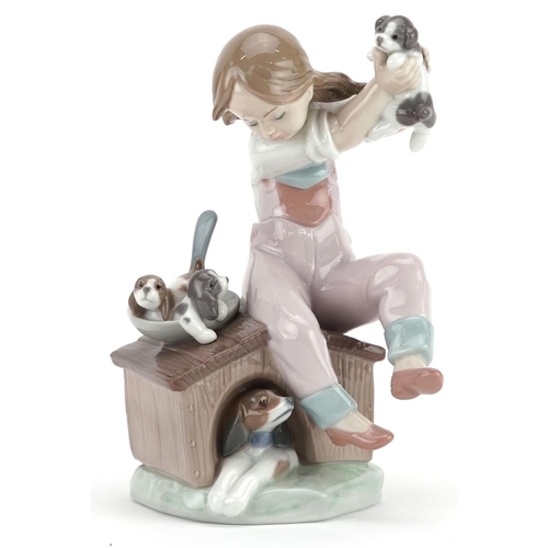 742 - A Lladro figure of girl holding a puppy - Pick of the Litter, numbered 7621, 19cm high, with box.