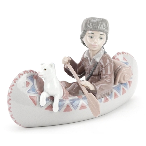 735 - A Lladro figure group of a child with a puppy in a boat - Little Explorer, numbered 6640, 26cm in le... 