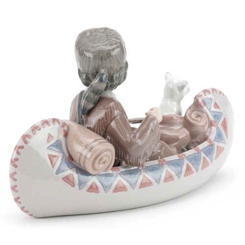 735 - A Lladro figure group of a child with a puppy in a boat - Little Explorer, numbered 6640, 26cm in le... 