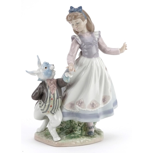 741 - A Lladro figure group of a girl and a bunny holding hands - Alice in Wonderland, numbered 5740, 22cm... 