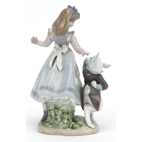 741 - A Lladro figure group of a girl and a bunny holding hands - Alice in Wonderland, numbered 5740, 22cm... 