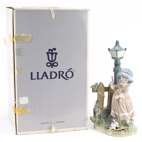 723 - A Lladro figure of a young girl sweeping leaves - Fall Clean Up, numbered 5286, 34cm high, with box.